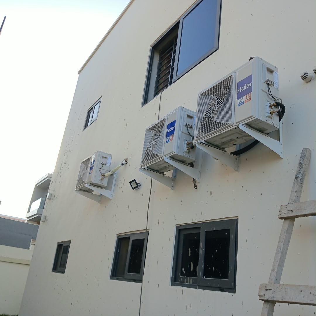 Wall-mounted Haier air conditioning outdoor units installed by Ril Max Services.